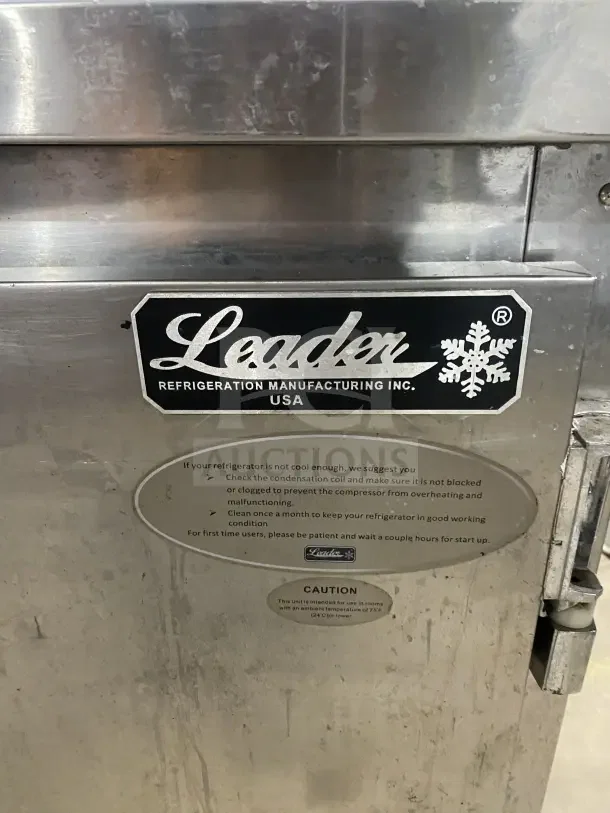 Leader stainless steel single-door undercounter refrigerator on casters, includes poly coated wire rack. Visible label: Leader Refrigeration Manufacturing Inc., USA.
