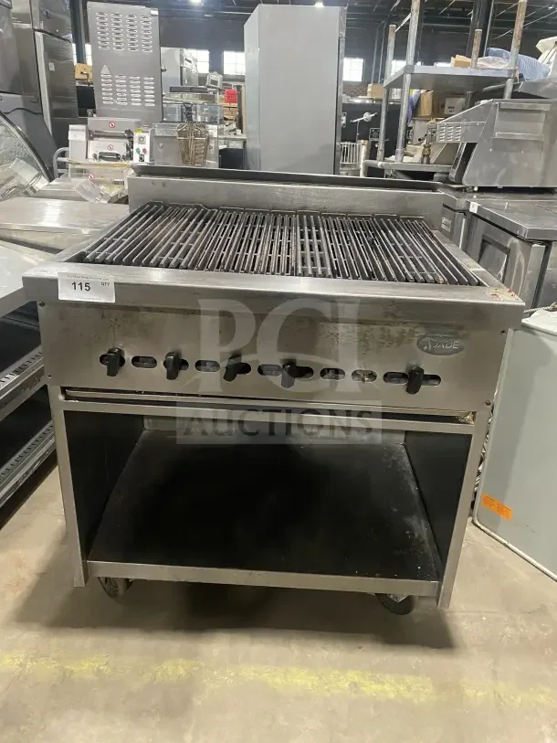 Jade Bistro stainless steel gas charbroiler with open cabinet base, on casters. Excellent condition. Model 115 visible.