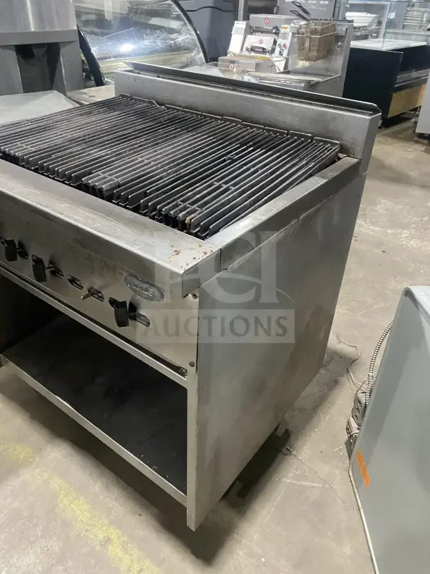 Jade Bistro stainless steel gas charbroiler with open cabinet base, on casters. Features control knobs and ventilation.