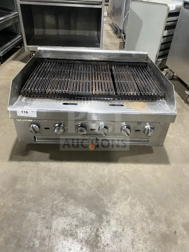 Southbend stainless steel gas charbroiler with back and side splashes, featuring control knobs. Commercial condition.