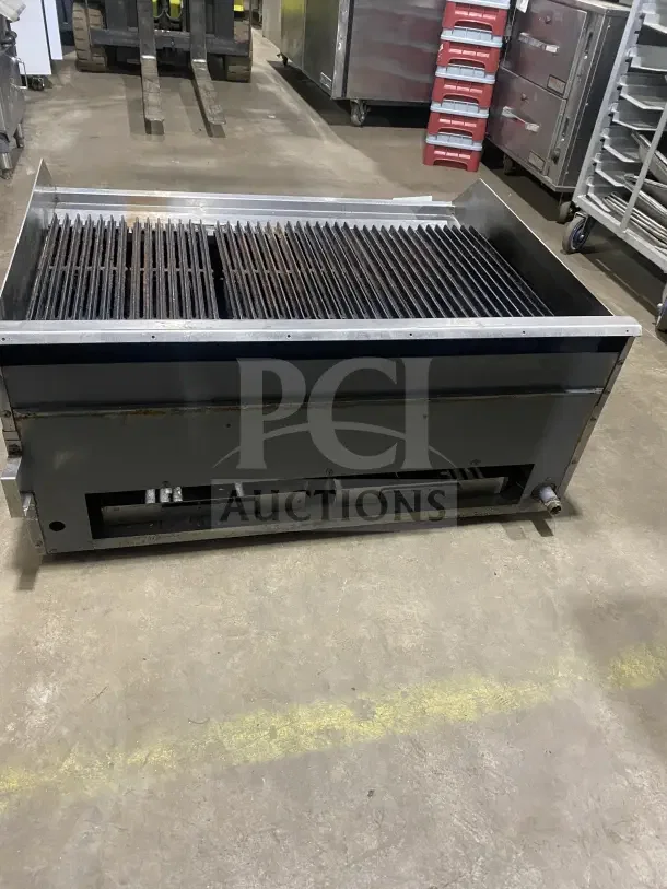 Southbend commercial stainless steel gas charbroiler with back and side splashes, used condition, visible grates.