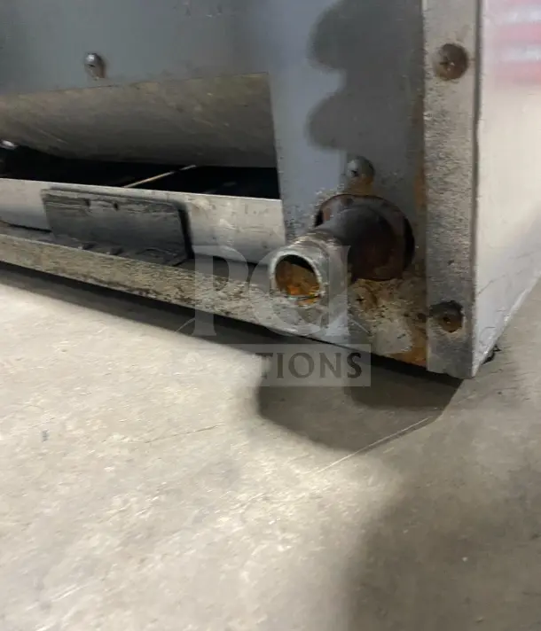 Southbend stainless steel gas countertop charbroiler with back and side splashes, visible wear, designed for commercial use.