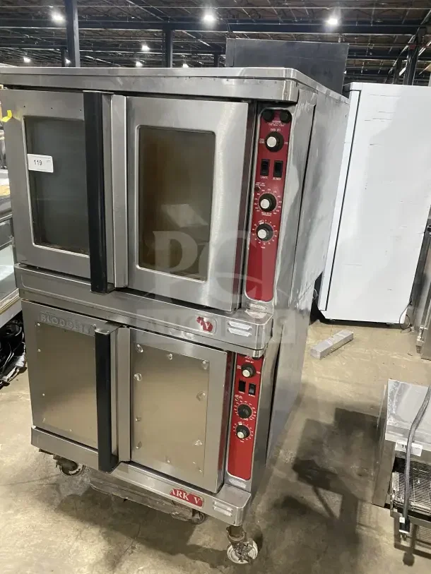 Blodgett commercial stainless steel double stacked convection oven on casters, featuring wired oven rack and control knobs.