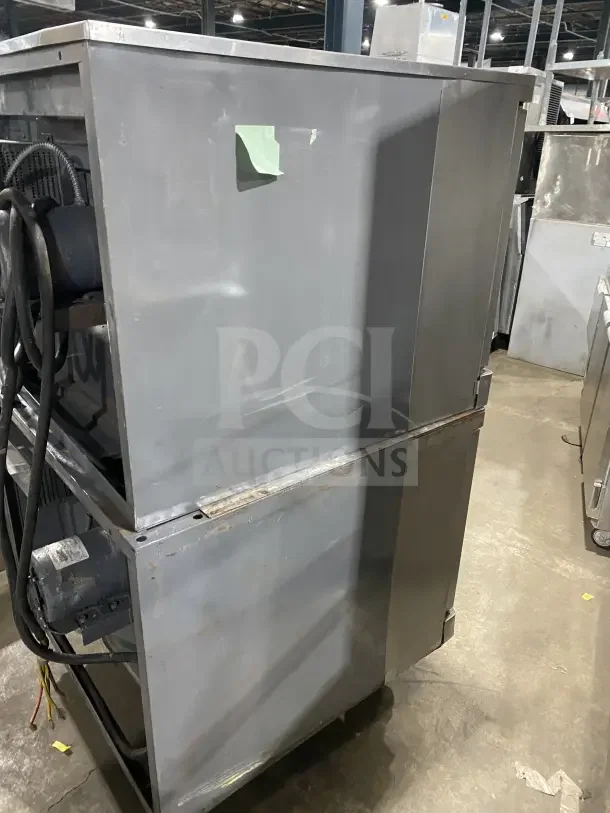 Blodgett double stacked stainless steel convection oven on casters, with wired oven rack, electric powered, used condition.