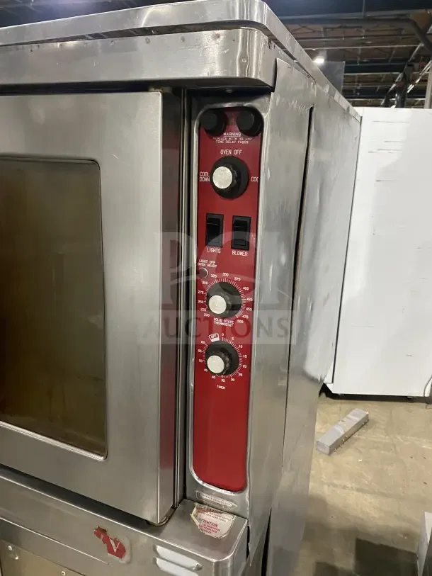 Blodgett stainless steel electric convection oven, double-stacked with wired rack, control panel visible, on casters.
