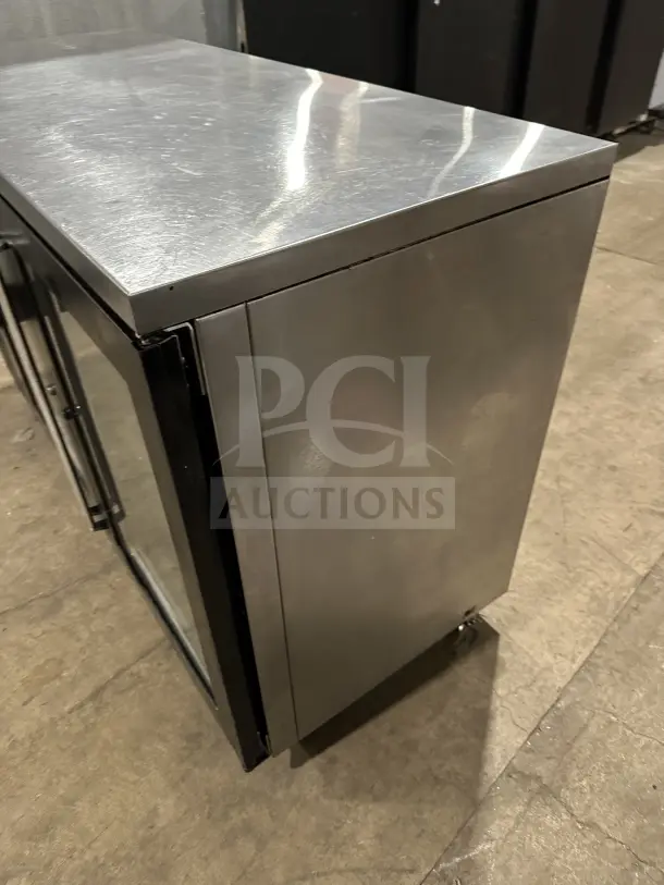 Perlick BBS60 commercial stainless steel 2-door bar back cooler with chrome wire rack, on casters, like new condition.