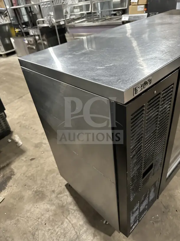 Perlick BBS60 commercial stainless steel 2-door bar back cooler. Features chrome-plated wire rack, on casters. Model SN: 713287.