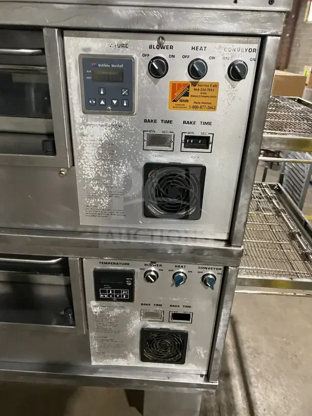 Middleby Marshall PS570S double deck conveyor pizza oven, stainless steel, natural gas, 208/240V, on casters, service tag visible.
