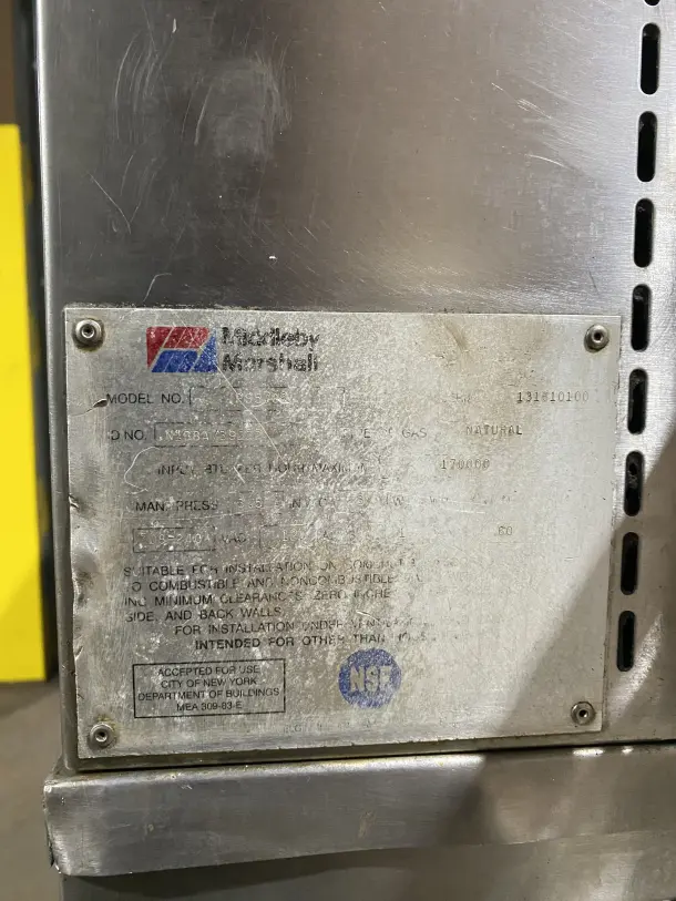 Middleby Marshall PS570S stainless steel double deck conveyor pizza oven, natural gas, on casters, model tag visible.