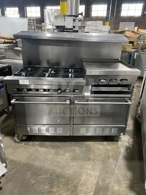 Sunfire stainless steel gas range with 6 burners, side griddle, 2 ovens, and wire rack on casters. Commercial use.
