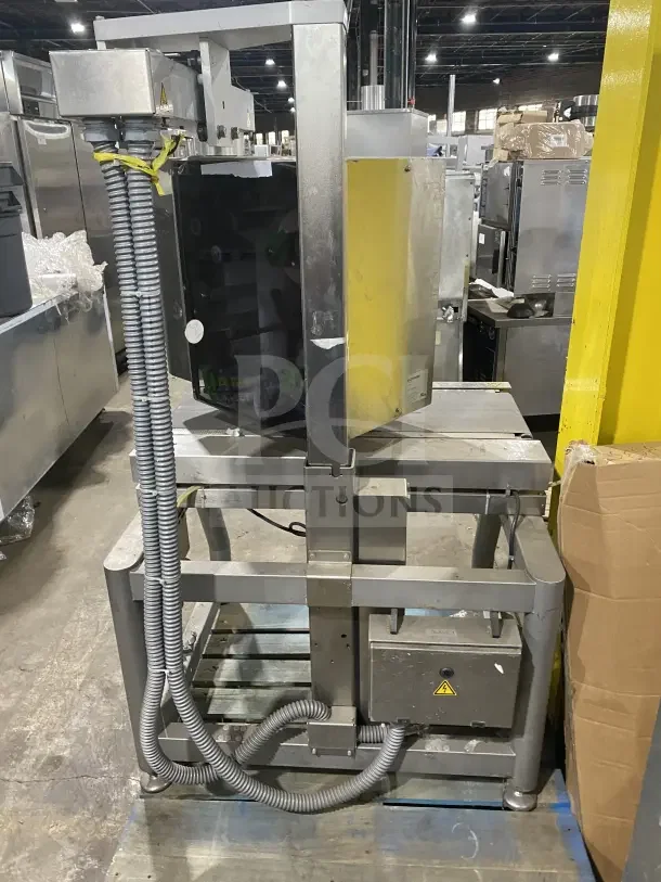 Bizerba commercial stainless steel electric weigh price labeling machine on legs with digital push controls, industrial setting.