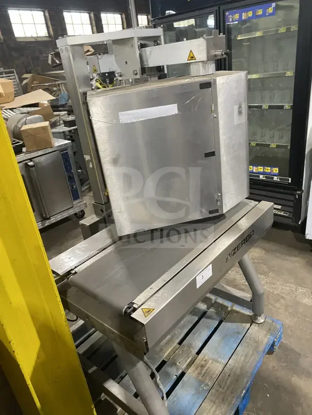 Bizerba stainless steel electric weigh price labeling machine, with digital push controls, on legs, industrial setting.