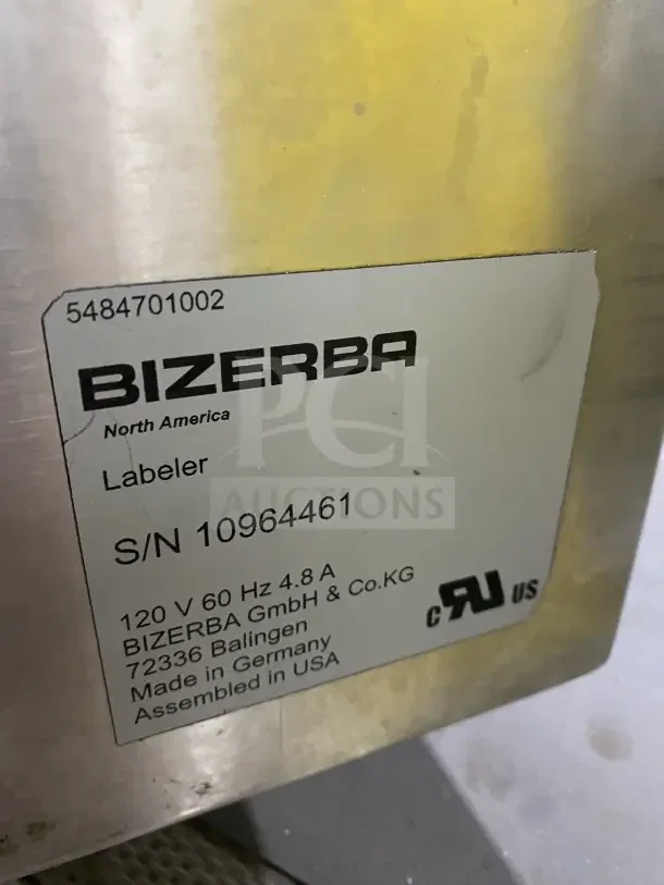 Bizerba stainless steel electric weigh price labeling machine, digital controls, on legs, with model and serial numbers visible.