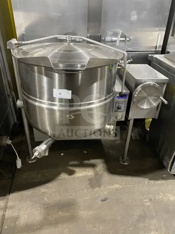 Cleveland Range Enodis Series 40-gallon stainless steel tilting steam kettle, Model KGL40T, with swivel spout faucet, on legs.