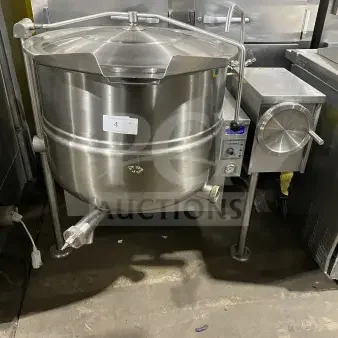 Cleveland Range Enodis Series 40-gallon stainless steel tilting steam kettle, Model KGL40T, with swivel spout faucet, on legs.
