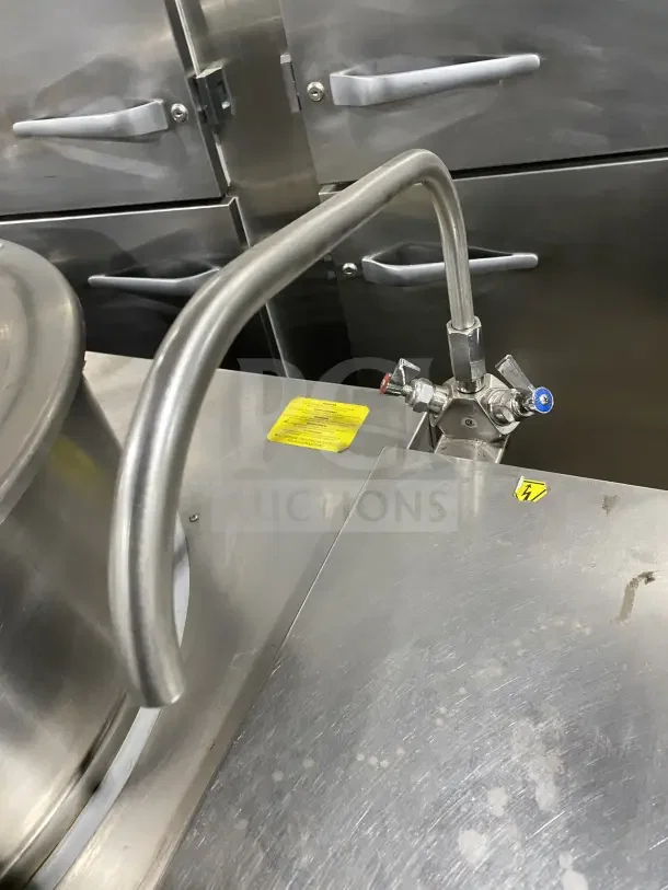 Cleveland Range Enodis 2/3 steam jacketed 40 gal. tilting steam kettle, model KGL-40-T, with swivel spout faucet, on legs.