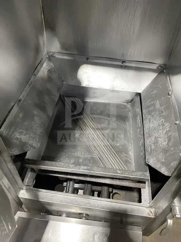 Commercial stainless steel vertical gas smoker oven, interior view. Features include durable construction and moveable casters.
