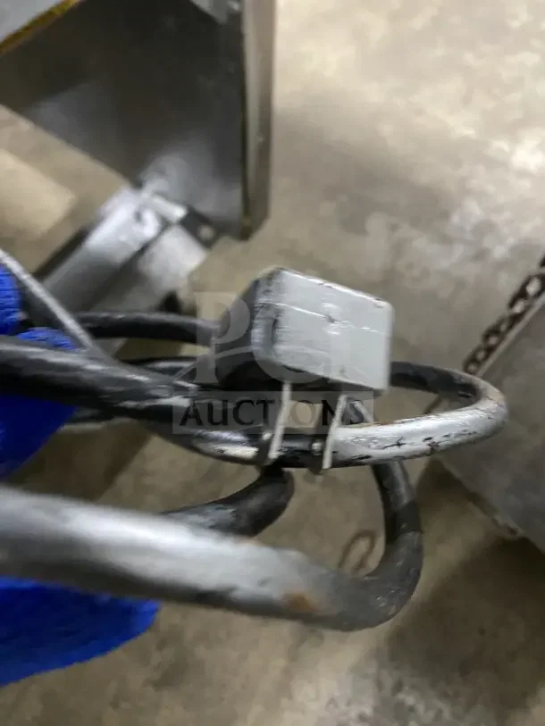 Close-up of a power cord attached to the Atosa MCF8707 commercial refrigerator, showing minor wear on connectors.