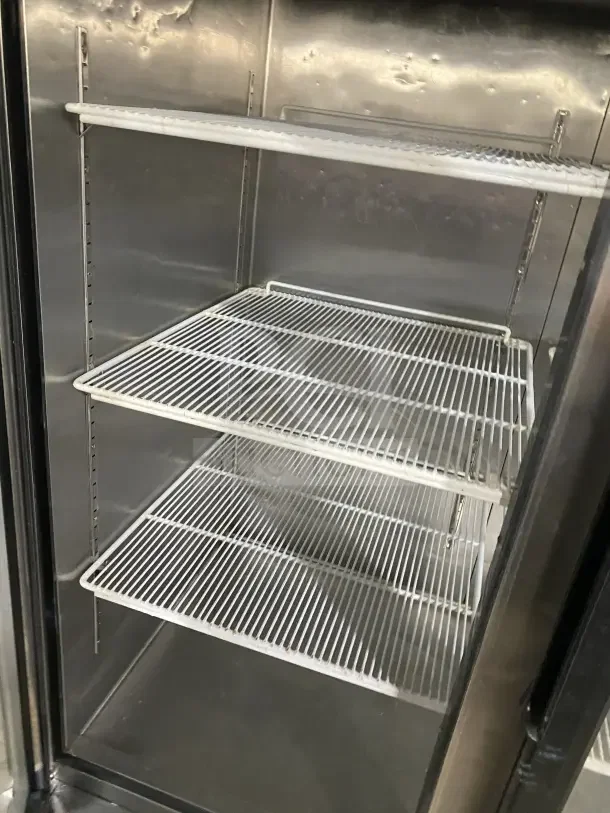 Atosa MCF8707 commercial fridge with double-glass swing doors, poly-coated wire racks, and casters. Model shown is 115V, 1 phase.