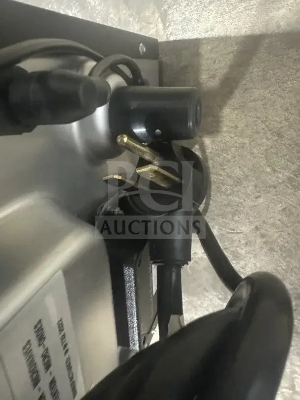 MerryChef Eikon E2S black electric countertop oven power plug, 208/240V, 1 phase. Model and serial number label visible.