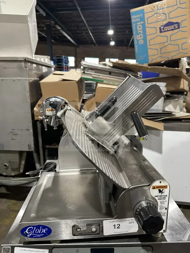 Chefmate Globe Series commercial deli meat slicer, stainless steel, electric powered, gravity feed, mounted on legs.