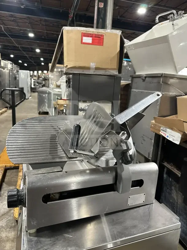 Chefmate Globe Series commercial stainless steel deli meat slicer, electric-powered, countertop model with manual gravity feed and legs.