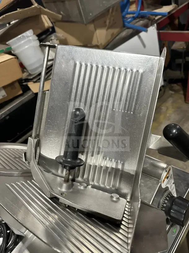 Chefmate Globe Series commercial stainless steel electric deli meat slicer, manual gravity feed, on legs, used condition.