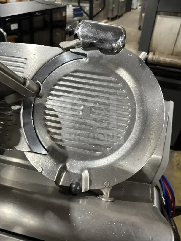 Chefmate Globe Series stainless steel deli meat slicer, electric, manual gravity feed, good condition, on legs.