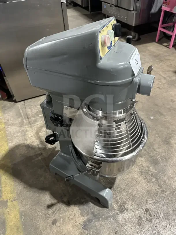 Globe commercial planetary mixer with stainless steel bowl and guard, excellent condition; sturdy countertop design.