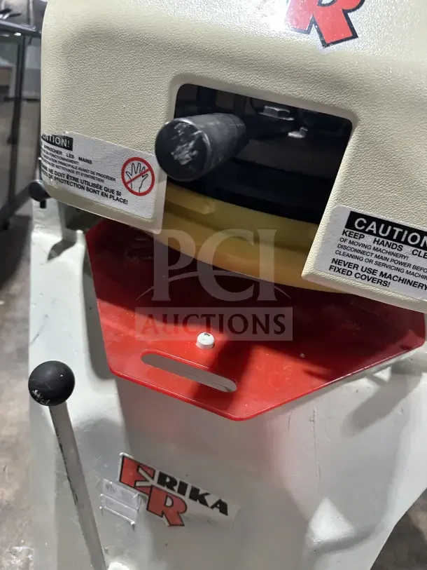 Erika Q2 dough press/divider/rounder, model SN: 14031. White with red accents, 220V, visible safety labels.