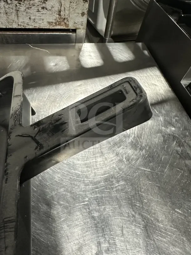 Black Continetal heavy-duty plastic commercial ice scoop on a stainless steel surface; new condition.