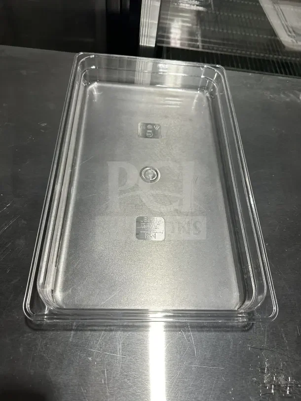 New Thunder Group PLPA8002 clear polycarbonate full-size food pan, 2.5" deep. Features embossed markings.