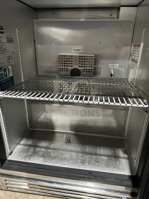 True TUC-24G-HC~FGD01 stainless steel undercounter refrigerator, single glass door, poly-coated wire rack, excellent condition.