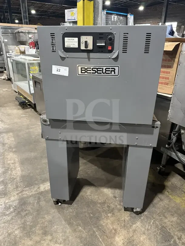 Beseler TD1610 shrink wrap system with heat tunnel, electric-powered, 220V, 1 phase, on casters, commercial use.