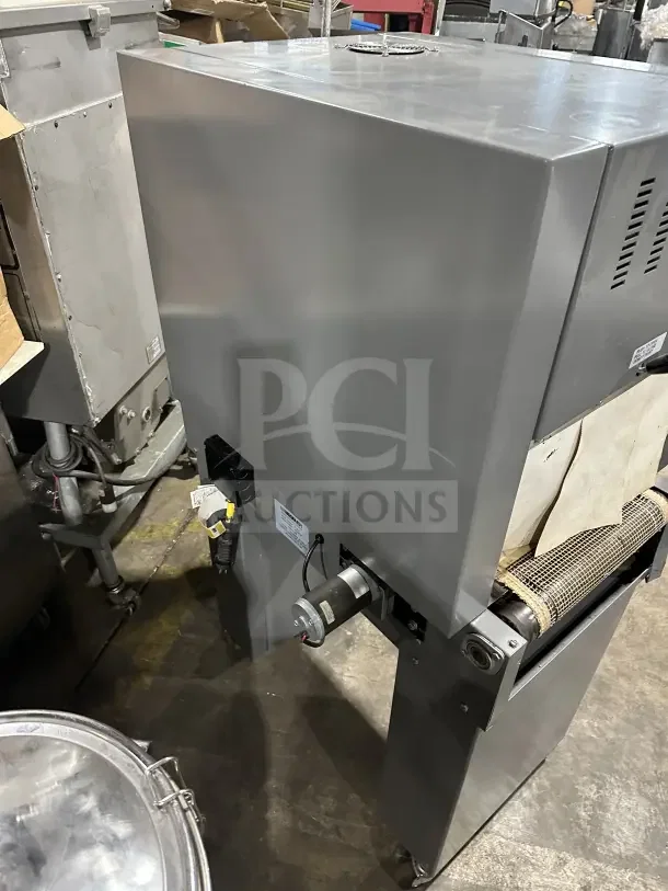 Beseler TD1610 shrink wrap system, electric-powered, 220V, 1 phase, on casters, with visible motor and control labels.