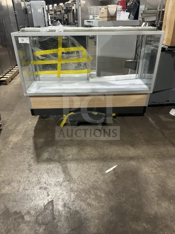 Commercial glass display case with extra-vision design, wood base accent, and protective packaging. Ideal for retail use.