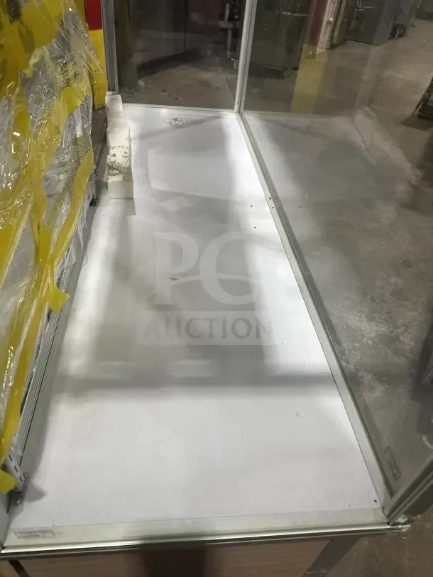 Commercial glass display case with extra-vision feature, wood base accent, and reinforced corners. Good condition.