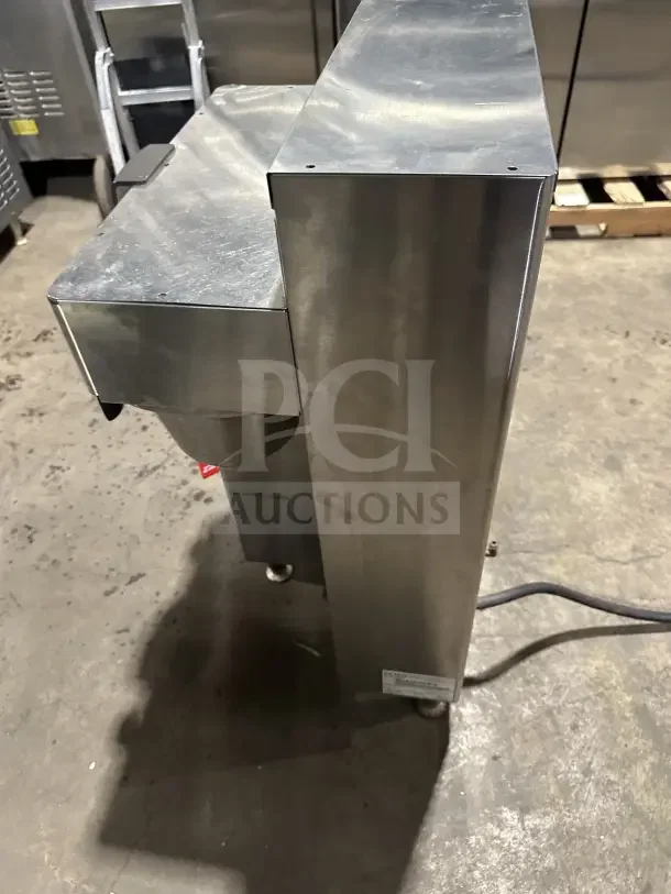 Fetco CBS-2142-XST twin coffee brewer, stainless steel, electric, countertop, 200/240V, 1 phase, on legs, visible wear.