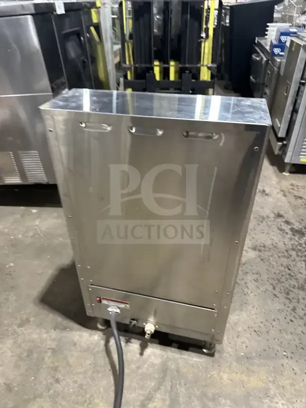 Fetco stainless steel twin coffee brewer, model CBS2142XST. Electric, 200/240V, on legs. Good condition, for commercial use.