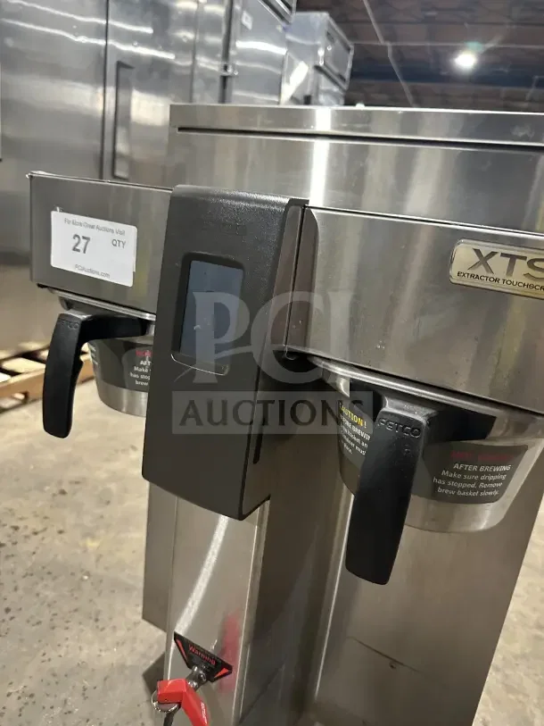 Fetco CBS2142XST stainless steel twin coffee brewer, electric, touchscreen, on legs, excellent condition, visible labels.