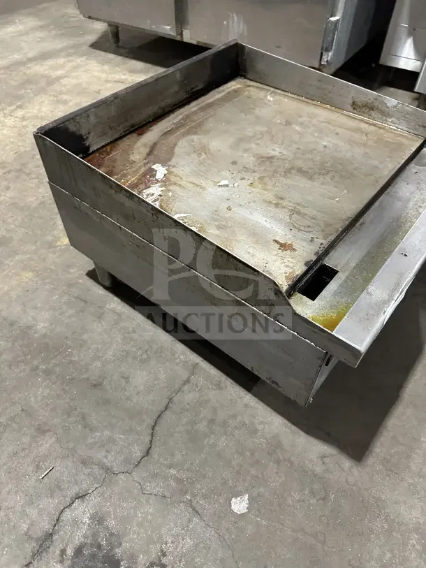 Vulcan 24" stainless steel natural gas countertop griddle, model VCRG24T1, on legs, showing signs of use.