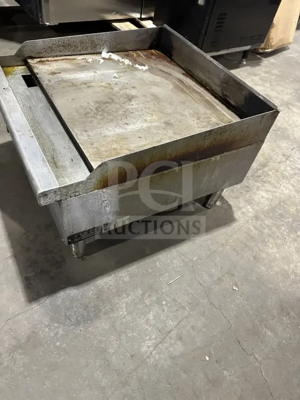 Vulcan VCRG24-T1 stainless steel gas countertop griddle, 24", on legs, used condition, visible surface wear.
