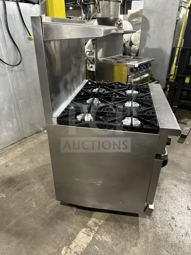 Radiance 6-burner stainless steel gas range and oven combo with backsplash, salamander shelf, and wire rack. Excellent condition.