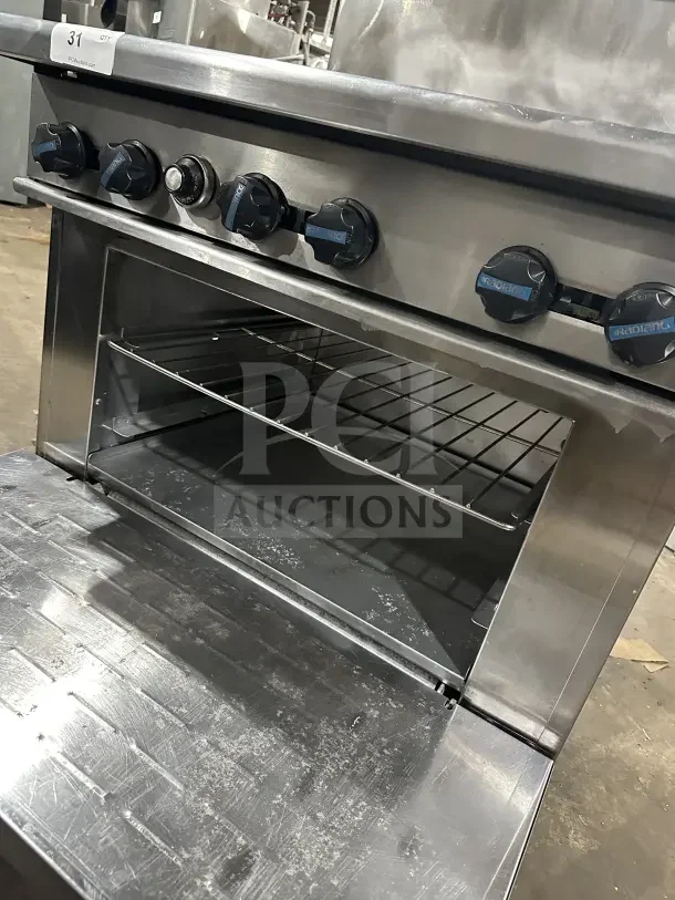 Radiance 6 burner gas range and oven combo in stainless steel, with wire rack, backsplash, salamander shelf, and leg support.