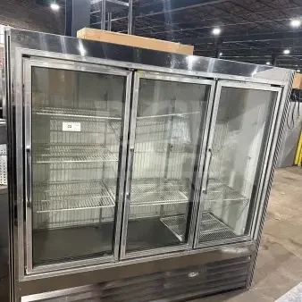 Commercial stainless steel 3-door sliding reach-in refrigerator merchandiser with glass doors and poly coated wire racks.