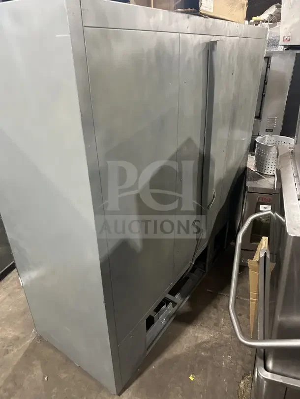 Commercial stainless steel 3-door sliding reach-in refrigerator with poly-coated wire rack, used condition.