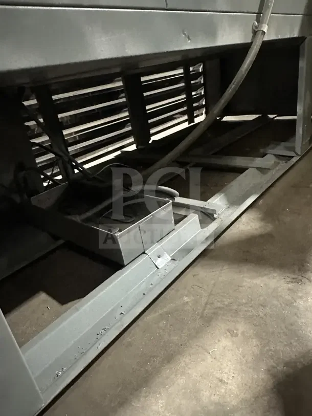 Commercial stainless steel glass 3-door sliding reach-in refrigerator with poly-coated wire rack, showing underside.