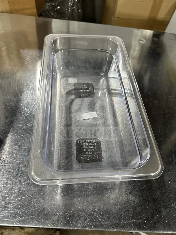 Winco SP7304 clear polycarbonate 1/6-size food pan, commercial-grade, new condition, capacity markings visible.