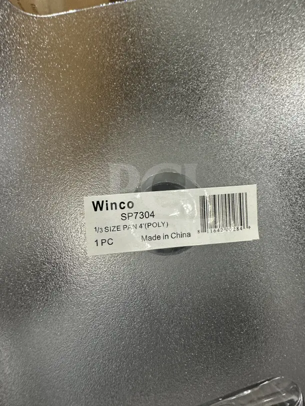 Winco SP7304 polycarbonate 1/6-size food pan, clear, new condition. Label shows "Winco SP7304, Made in China."
