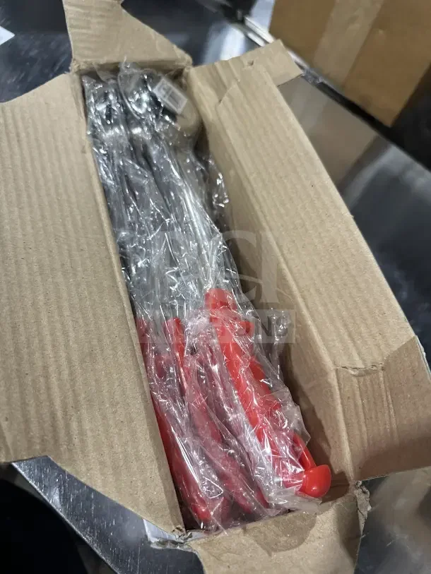 New commercial 2 oz stainless steel control spoons with red handles in open box. Sealed in plastic, pristine condition.